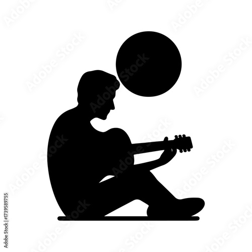 Silhouette of rock musician playing guitar
