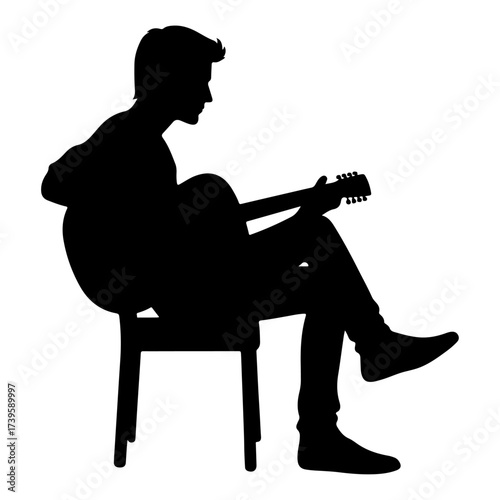 Silhouette of rock musician playing guitar