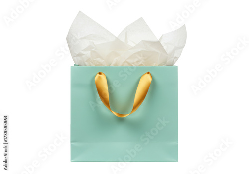 Elegant light blue gift bag with gold ribbon handles isolated, filled with white tissue paper for birthdays and special occasions
