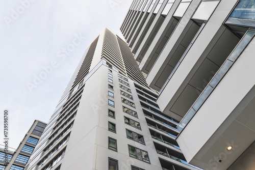 Upward View of Modern High Rise Residential Towers with Glass Facades in City
