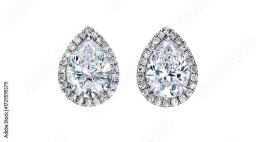 A pair of sparkling diamond teardrop earrings with a halo of smaller gems, isolated on black