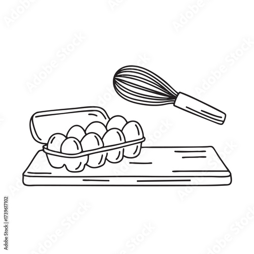 A whisk near a carton of eggs on the kitchen counter