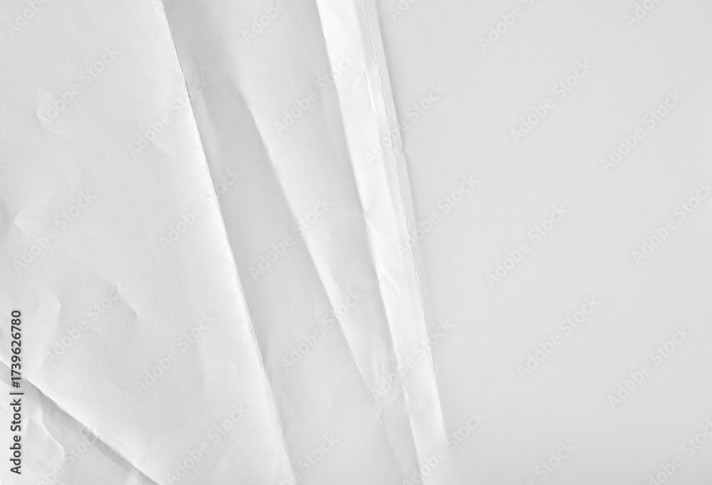 Obraz premium New blank white paper sheet, folded and wrinkled background and texture