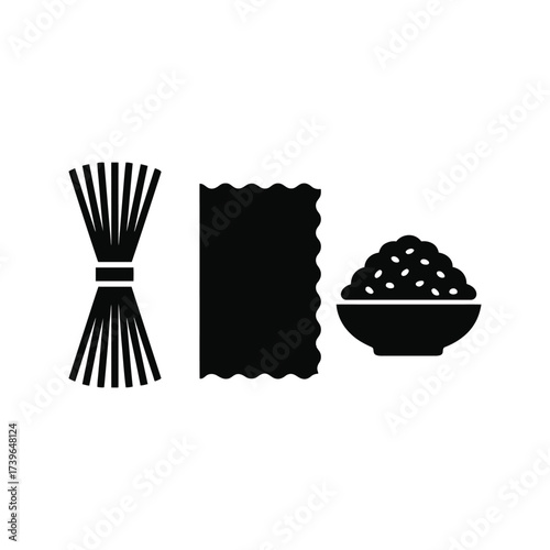 Wheat grains, flour, and a bowl of flour.