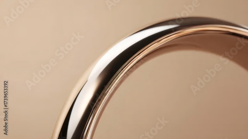 Close up Golden Metal Pipe Arch on Beige