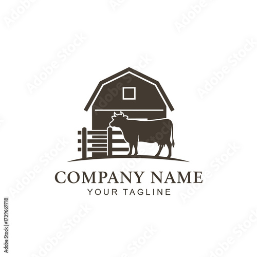 A logo design featuring a cow silhouette standing by a wooden fence in front of a classic barn.