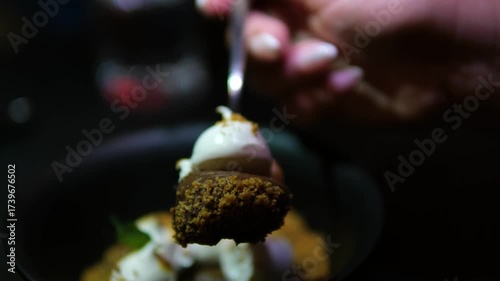 Close up of woman showing piece of chocolate brownie with meringue on fork rotating dessert elegant gourmet sweet delicious indulgent treat video.