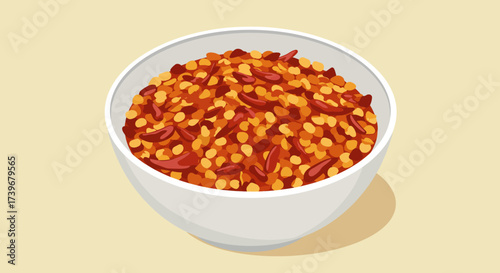 A white bowl is filled with red pepper flakes and seeds against a light yellow backdrop with a shadow