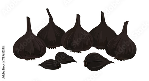 Six bulbs and two cloves of black garlic are grouped together