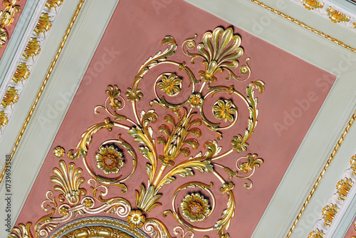 Wallpaper Mural Luxurious pink ceiling panel featuring gilded floral scrolls and intricate leaf motifs Torontodigital.ca