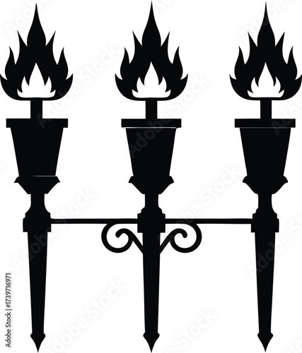 Three ornate black wrought iron torch sconces with flickering orange flames against