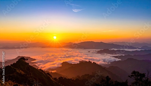 Sunrise Over Mountainous Landscape with Fog and Golden Light Scenery of Peaks Mist and Vibrant Sky Atmospheric View with Natural Beauty