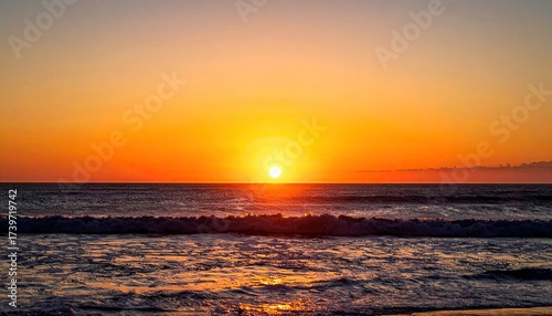 Sunset Over Tropical Ocean with Orange Skies and Sparkling Water Waves at Dusk