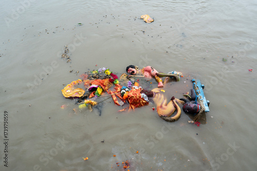 Hindu devotees immerse a clay idol of Goddess Durga into the Brahmaputra River on the concluding day of the Durga Puja festival
