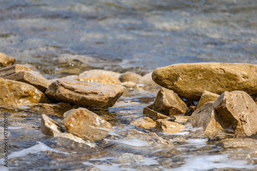 Fototapeta Naklejka Na Ścianę i Meble -  The rough Adriatic Sea in Croatia, waves lapping the stones on the beach Rab Croatia