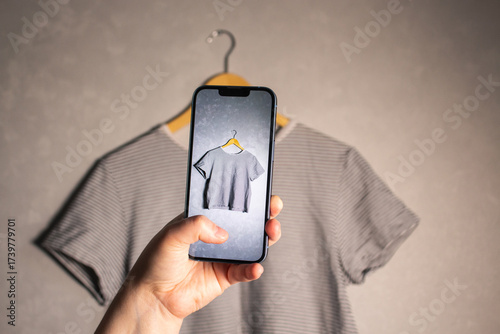 Female influencer prepares used garments for resale. Online second hand shop. Fashion circulation.