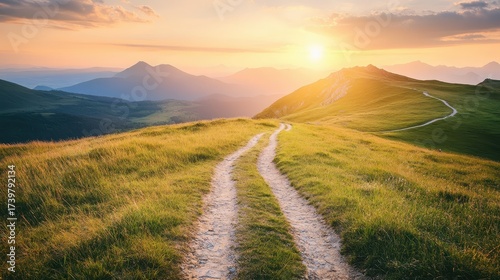 Winding dirt trail through rolling hills at sunset