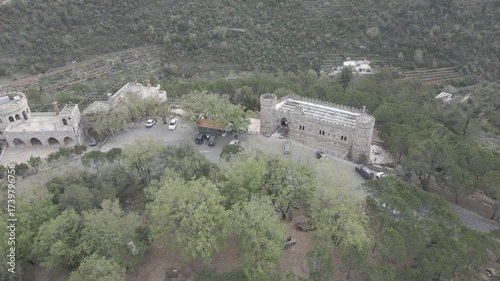 Aerial view of Moussa Castle, a famous historical landmark and museum located near Deir el Qamar, Lebanon, surrounded by forested mountains. 