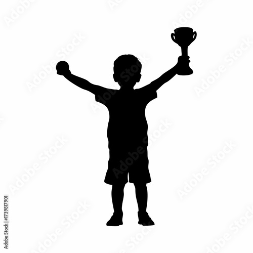 Silhouette of a boy celebrating with a soccer trophy isolated on white background
