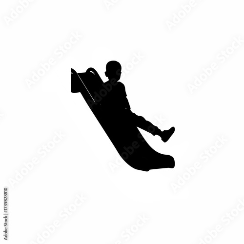 Silhouette of a boy sliding down a playground slide isolated on white background
