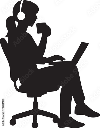 Silhouette of a woman wearing headphones drinking coffee and working on a laptop while sitting in an office chair