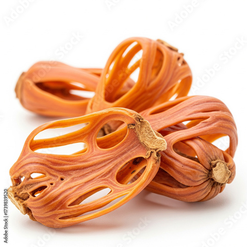 Close-up of dry whole mace spice (javitri) isolated on a white background.
