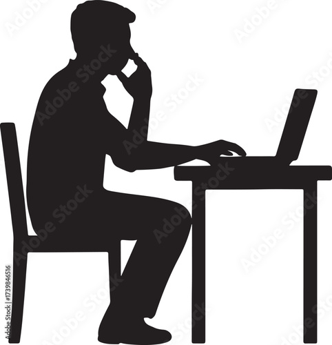 Silhouette of a man sitting at a desk typing on a laptop and talking on a mobile phone