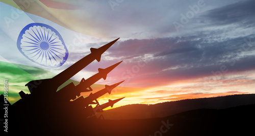 The missiles are aimed at the sky at sunset with Indian flag. Nuclear bomb, chemical weapons, missile defense, a system of salvo fire.
