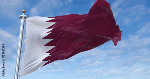 Qatar flag with flagpole waving in wind, rolling clouds background looping, 4K video (Perfect Loop)