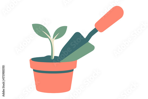 Newly planted sprout in a terracotta pot next to a garden hand shovel