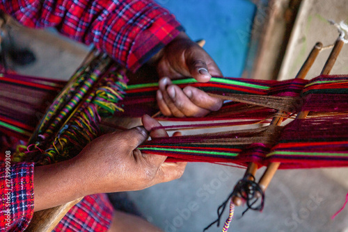 The weaving hands of a woman from the village of Tupe, laborious craftsmanship, with great patience and creativity, bring the fabrics to life. Tupe, Yauyos, Perú.