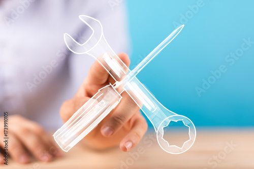 Hand holding digital tools,...