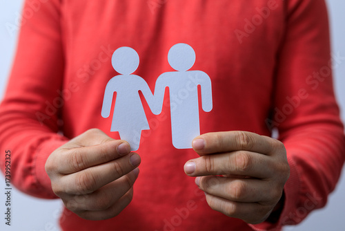 A person holds a paper cut ...