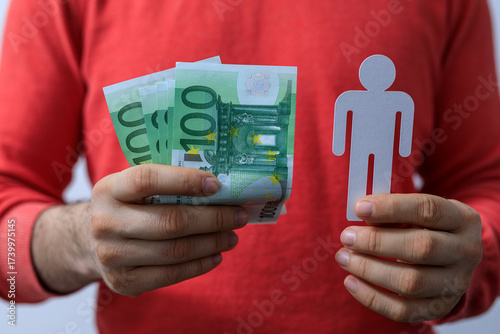 A person holds euro banknot...