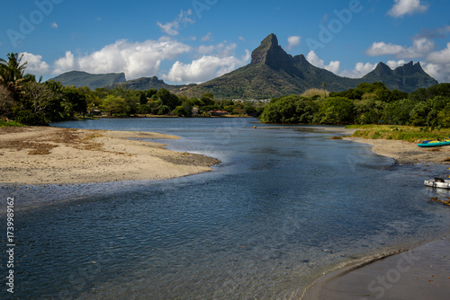 Panoramic view of the Trois Mamelles mountain from the shore of Rampart river in Tamarin, Mauritius island