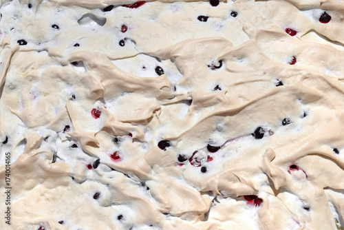 Cake with meringue, black and red currant, top view