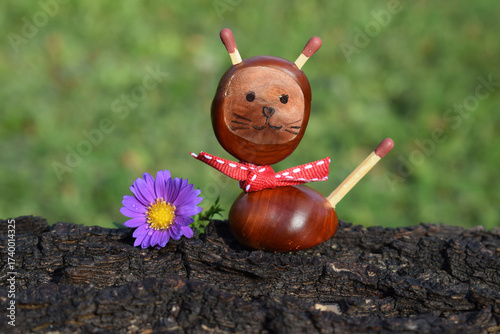 Cute cat made of chestnuts. Autumn time