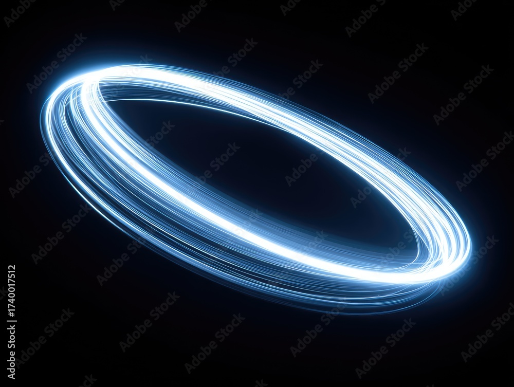 Obraz premium Bright blue light trails create a glowing, orbiting ring against a dark, black background