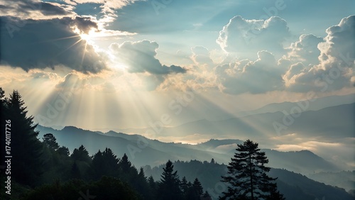 Sun Rays Breaking Through Clouds Over Mountain Forest Landscape