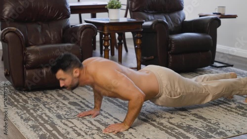 Shirtless Man Doing Push-Ups at Home in Athletic Pants