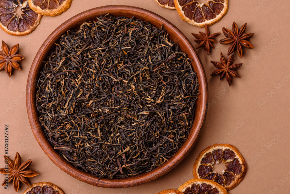 Fototapeta premium Golden black tea, dried leaves of a Chinese or Indian breakfast drink. Black tea dried leaves