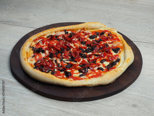 A full pizza against a light background, at a 45-degree angle