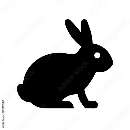 Silhouette of a rabbit with long ears and a short tail in a simple black and white illustration