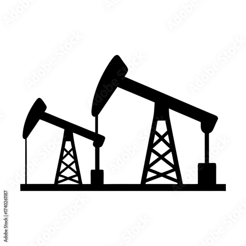 Silhouette of two oil pump jacks used for extraction of crude oil