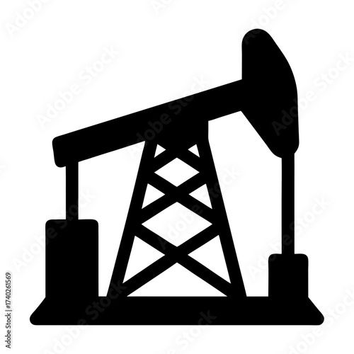 Silhouette of an oil pump jack extracting crude oil from the earth