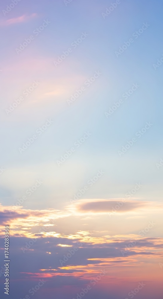 Fototapeta premium Soft Pastel Sunset Sky with Wispy Clouds and Gentle Hues sky background of Portrait