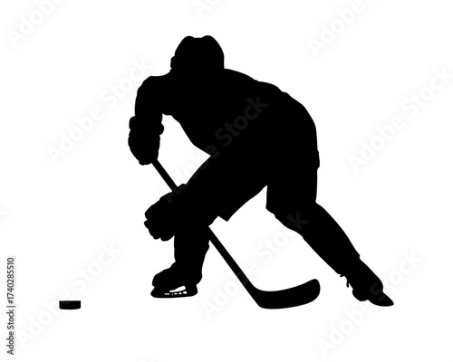 Ice hockey player silhouette dribbling puck with stick