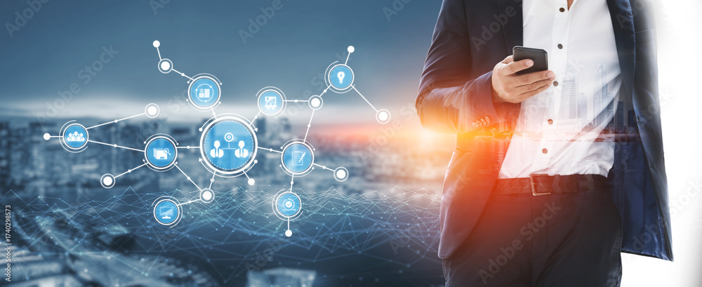 Obraz premium A businessman stands with a smartphone, surrounded by digital connection icons and a city skyline, illustrating technology role in modern networking and communication. Tessel