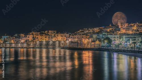 Supermoon Rising Over the Illuminated Old Town of Vieste Puglia