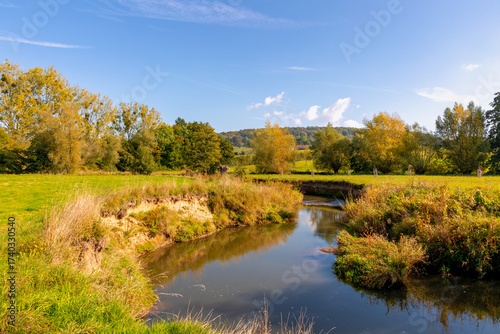 Autumn landscape, Terrain hilly countryside in Zuid-Limburg with a small kleine Geul river between the farm and forest, Epen is a village in southern part of the Dutch province of Limburg, Netherlands